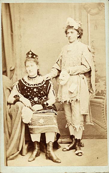 Two Victorians in Costumes with Masks