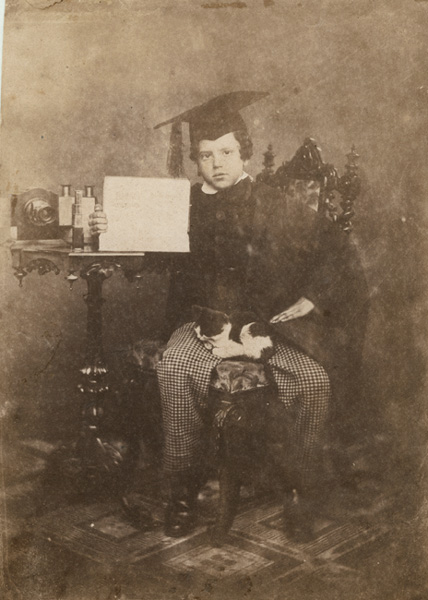 Anonymous (English) - Young Graduate with Rare Lens, Stereo Viewer, Sign and a Cat in His Lap