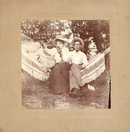 Woman and Man on Hammock with Pistols
