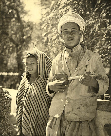 Algerian Boy with String Instrument and Girl