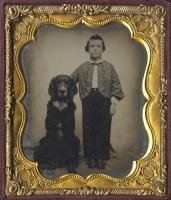 Anonymous, American - Studio Portrait of a Young Boy Standing Beside His Large Black Dog