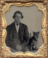Anonymous, American - Studio Portrait of a Man and His Dog Seated Together