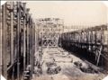 B. L. Spackman (attributed to) - Construction of the 1862 International Exhibition at South Kensington [Interior Framework with Two Figures]