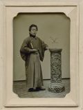 Izumi (Studio) - Young Man With Book Before Ornately Carved Pedestal