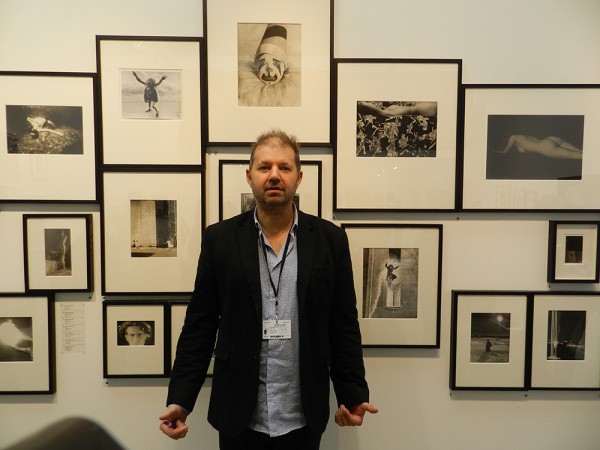 Philippe Jacquier in front of a wall of his booth. (Photo by Michael Diemar)