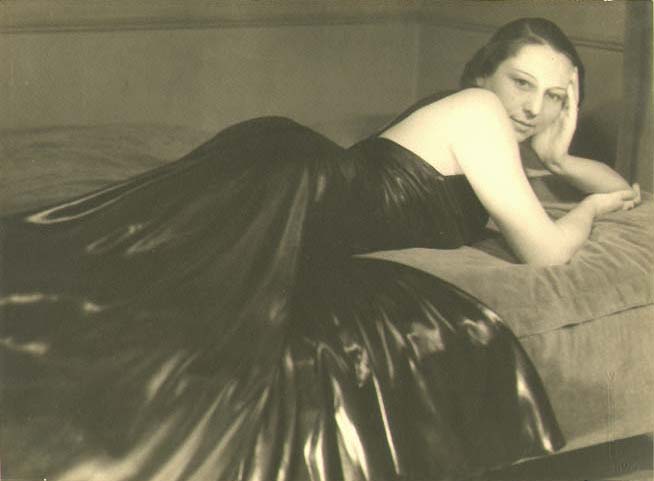 Woman Reclining in Black Leather Dress