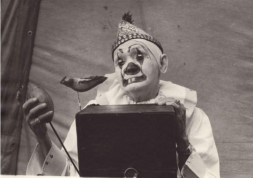 Millers Bros. Circus, St. Louis, MO (clown and camera with football style shutter and bird)