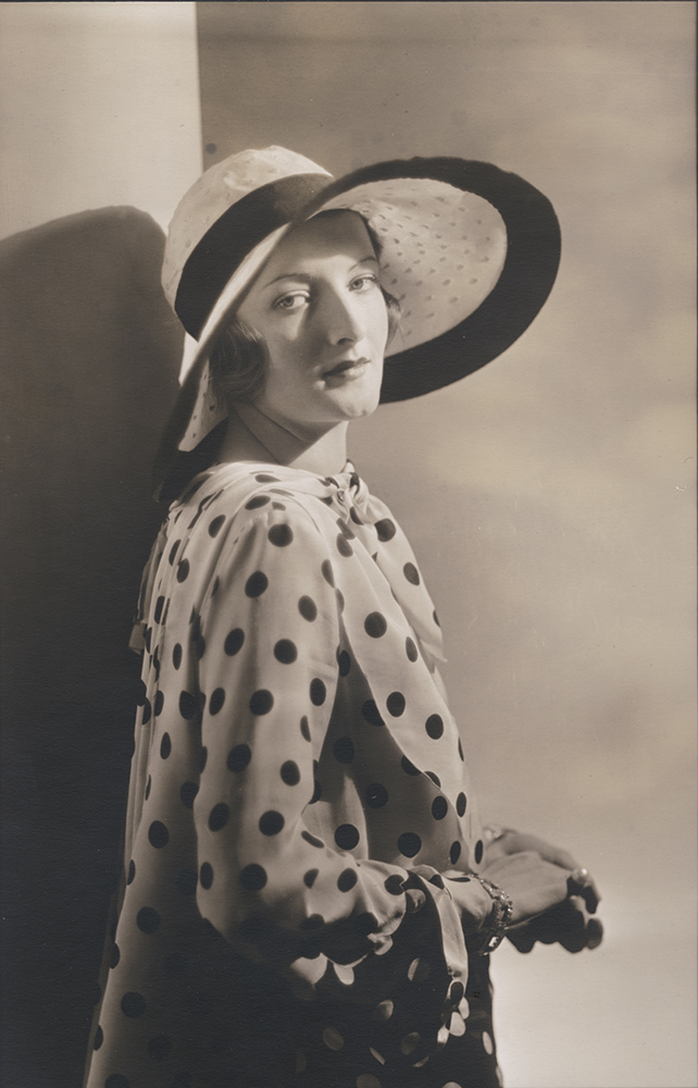 Woman in Polka Dot Shirt and Hat