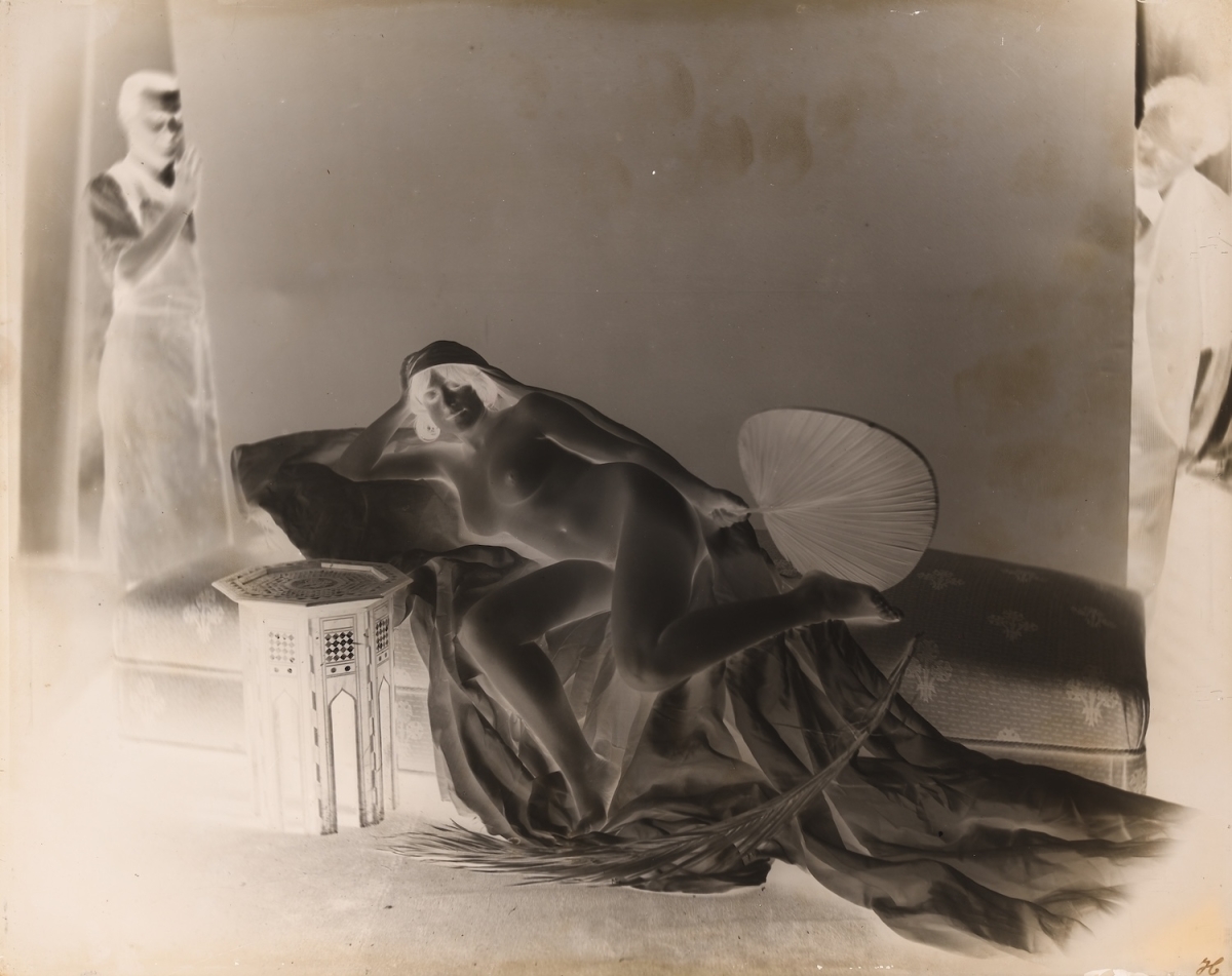 Female Nude with Two Male Assistants Holding Back Drop