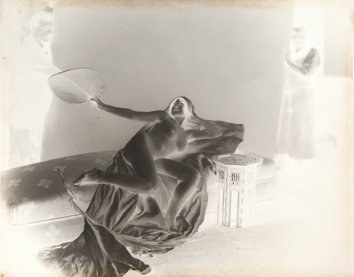 Female Nude with Two Male Assistants Holding Back Drop