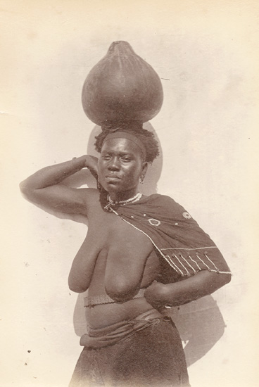 Partially Nude Bantu Woman Balancing a Water Gourd on Her Head