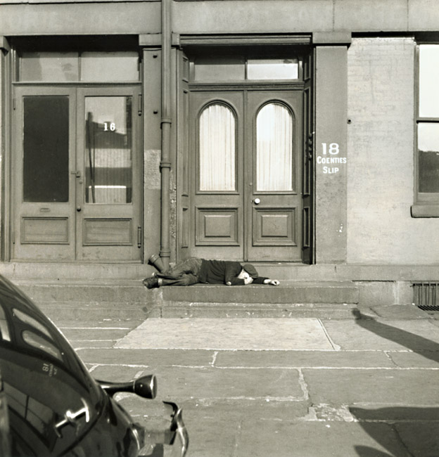 Fritz Henle - Man Lying on Stoop of New York City Brownstone