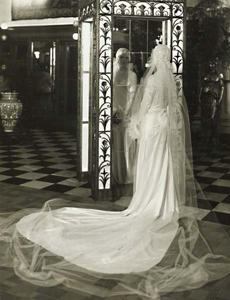Bride Examing Her Wedding Gown in the Mirror