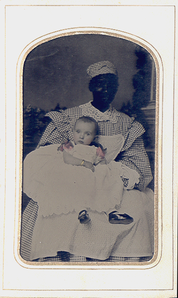 Portrait of a Black Nanny Holding a White Baby