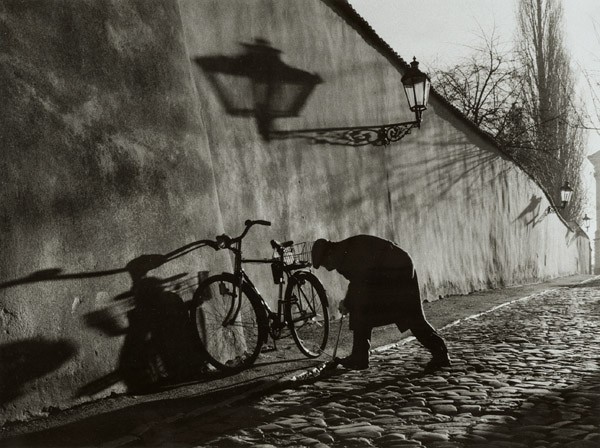 Stanko Abadzic, Untitled (Man Repairing Bicycle Tire), 2000.