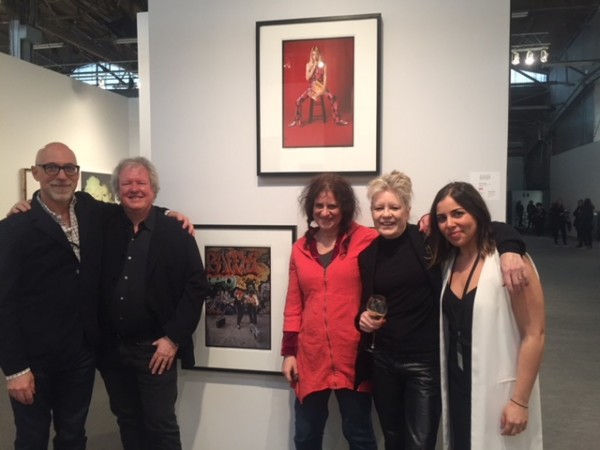 Steven Kasher embracing Chris Frantz with Tina Weymuth, Laura Levine, and SKG Director Cassandra Johnson. Weymuth and Frantz were half of Talking Heads and in one of the photos on the wall by Levine.