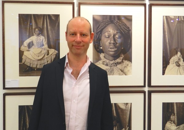 James Hyman in front of British photographer Heather Agyepong's series "Blackamoor".
