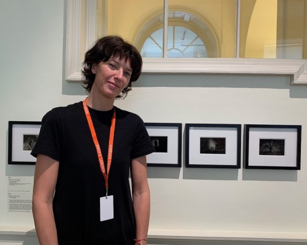 Rolf Art's director Florencia Giordana Braun, with works by Santiago Porter. (Photo by Michael Diemar)